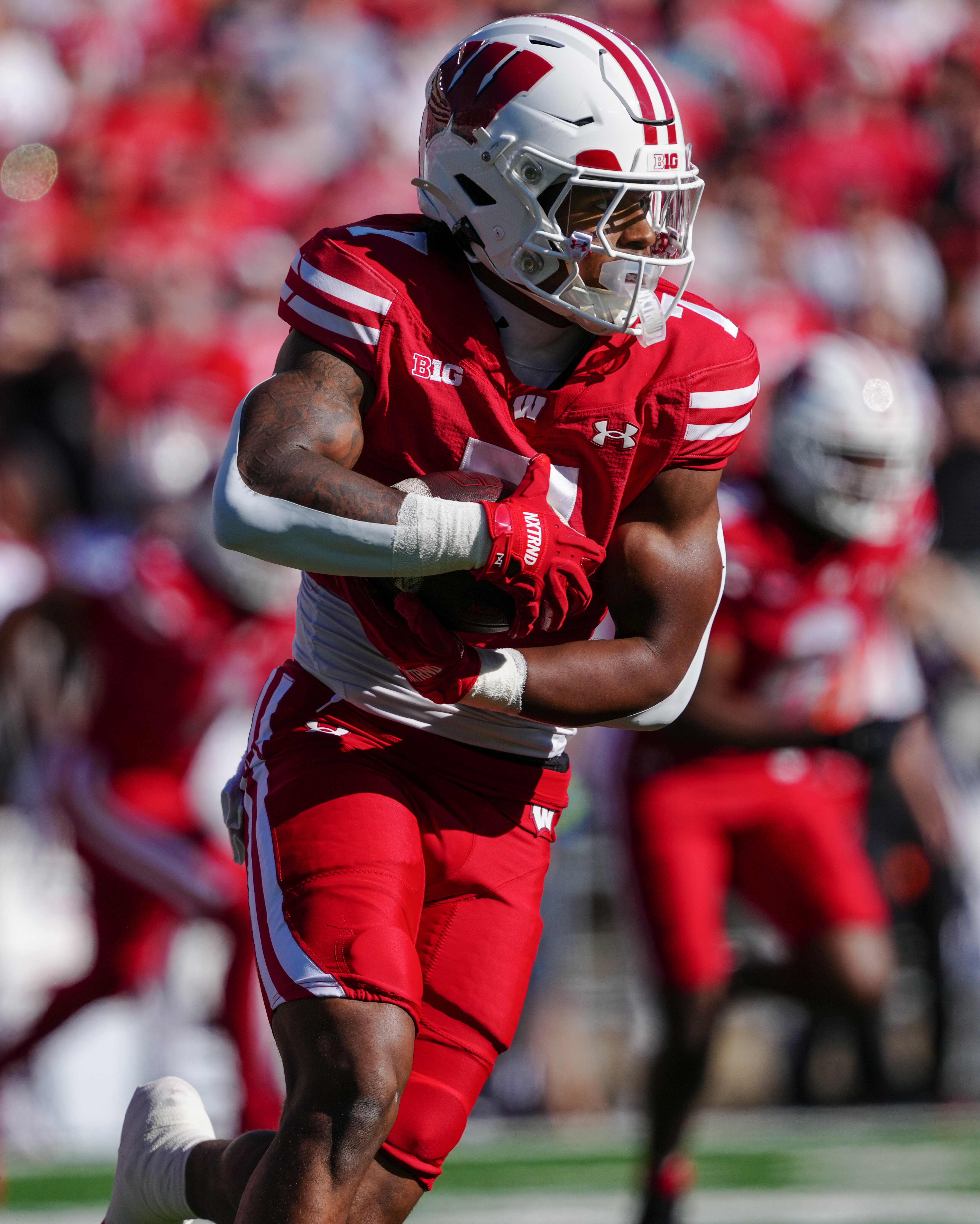 Oct 18, 2025; Madison, Wisconsin, USA; Wisconsin Badgers running back Dilin Jones (7) runs the ball in the first quarter against the Ohio State Buckeyes at Camp Randall Stadium on October 18, 2025 in Madison, Wisconsin. Photography by Ross Harried for Second Crop Sports.